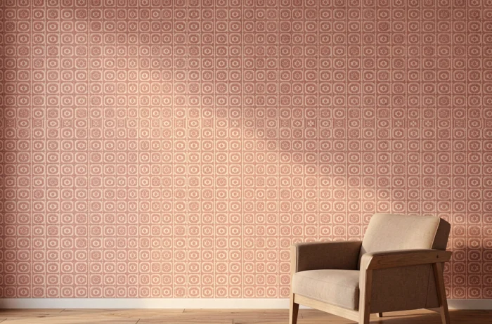 Papier peint panoramique personnalisé avec motif logo répété en rose poudré et ivoire sur un mur de salon